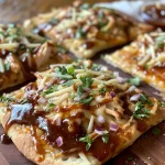 Juicy BBQ chicken flatbread pizza featuring a golden crust and vibrant ingredients.