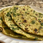Juicy spinach tortillas arranged attractively, emphasizing their green hue.