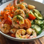 Detailed shot of a fresh shrimp salad, displaying cooked shrimp and assorted veggies.
