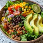 Side angle of a delicious Chicken Avocado Corn Salad, highlighting its colorful components.
