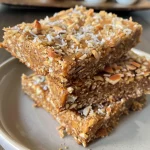 A close-up view of Keto breakfast bars with a golden-brown exterior and chocolate chips.