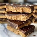 Close-up view of No-Bake Peanut Butter Cup Bars with a creamy texture and chocolate drizzle.