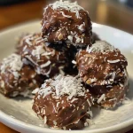 Juicy Sugar-Free Chocolate Coconut Clusters on a plate, emphasizing the contrast between chocolate and coconut.
